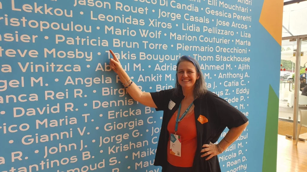 Pointing at my name on the organisers + volunteers wall