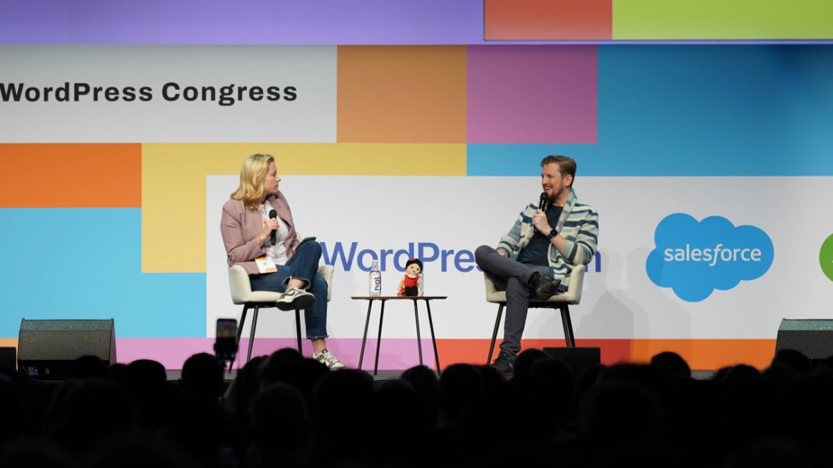 Mary Hubbard and Matt Mullenweg on stage at WordCamp Europe 2025. Photo by Paco Marchante