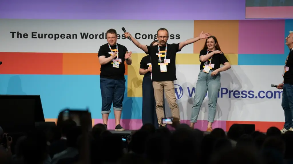 Sebastian Miśniakiewicz and other people on stage after the announcement for WordCamp Europe 2026 in Kraków. Photo by Atsushi Ando